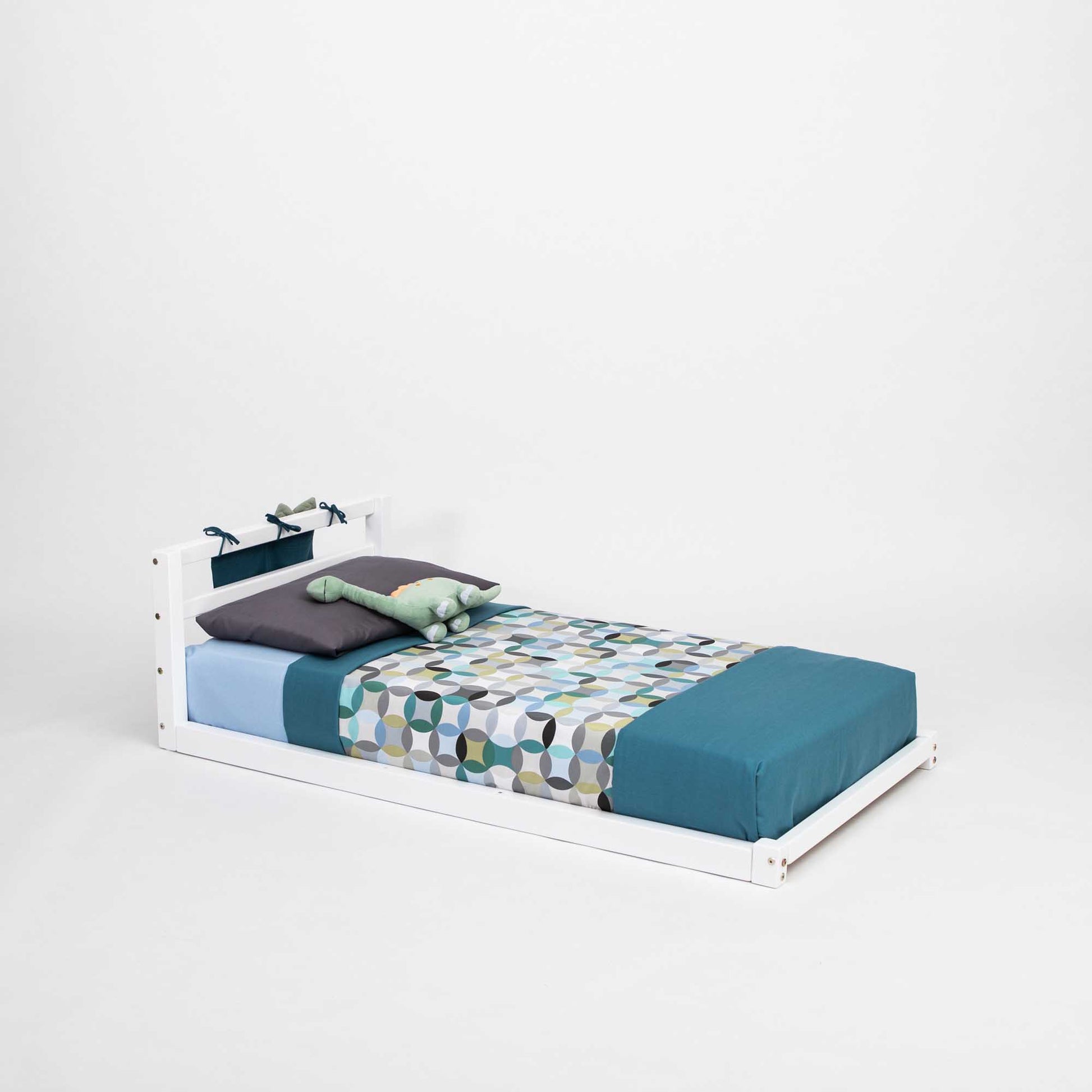 A Sweet Home From Wood toddler floor bed with a horizontal rail headboard, perfect for toddlers or young girls.