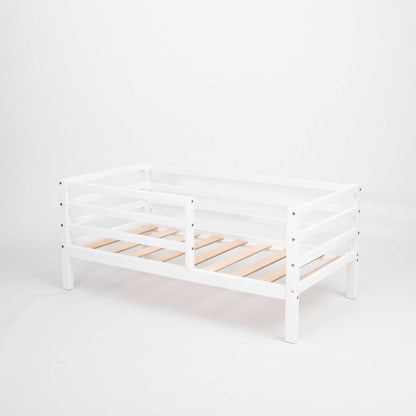 A Sweet Home From Wood Kids' bed on legs with a horizontal rail fence, with wooden slats on a white background.