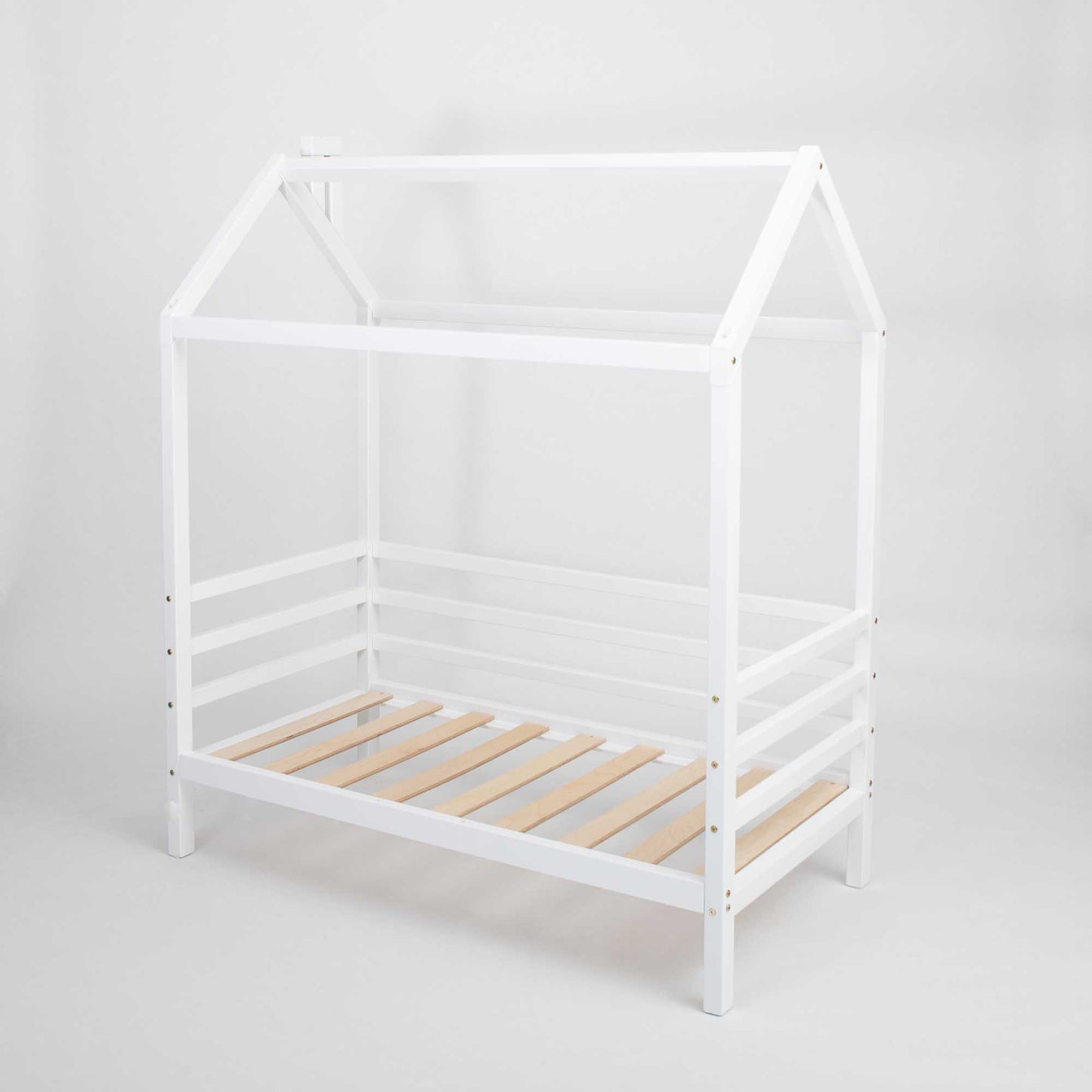 A children's house bed on legs with 3-sided rails with wooden slats.