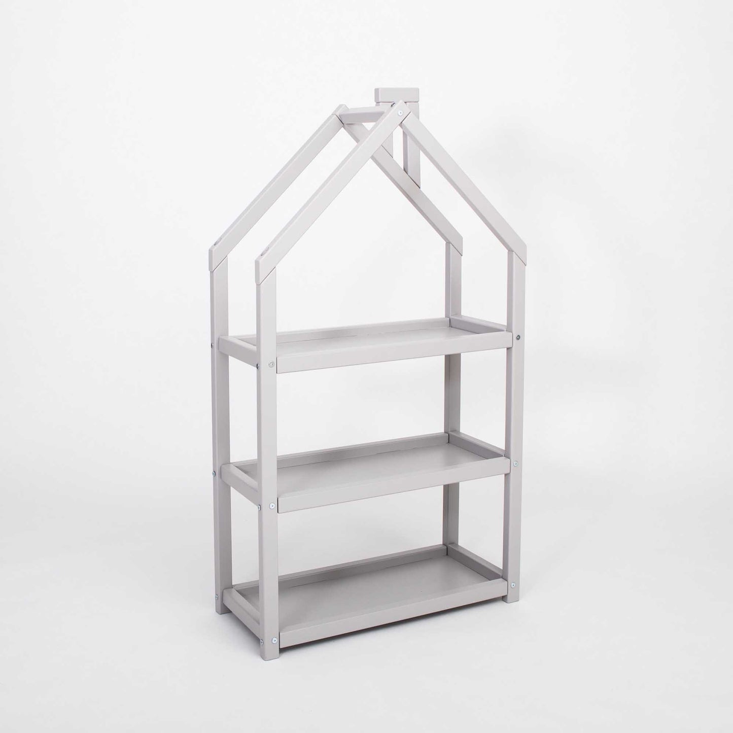 A Sweet Home From Wood house-shaped Montessori shelf, serving as an organizer.