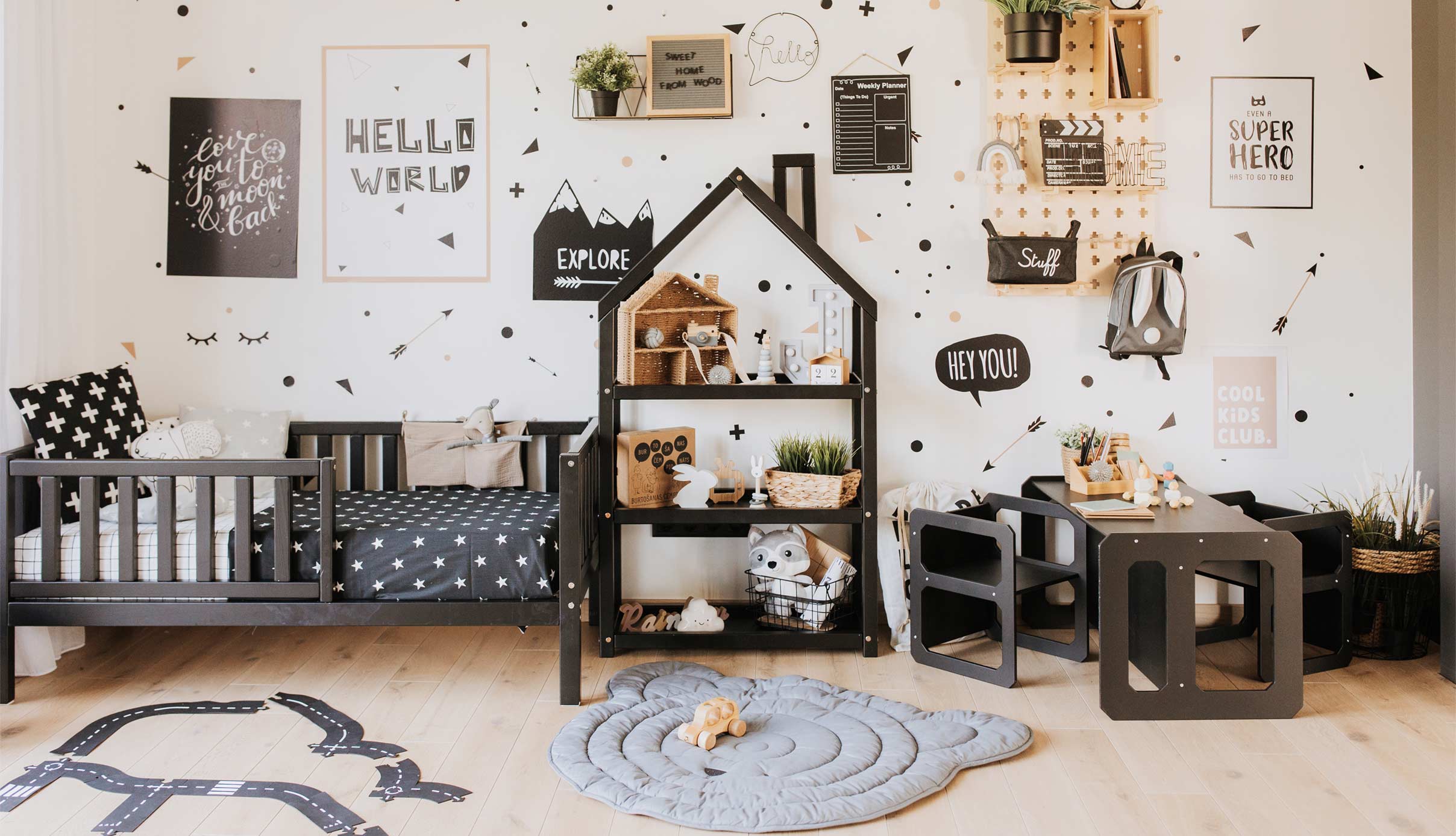 A child's room with black and white decor.