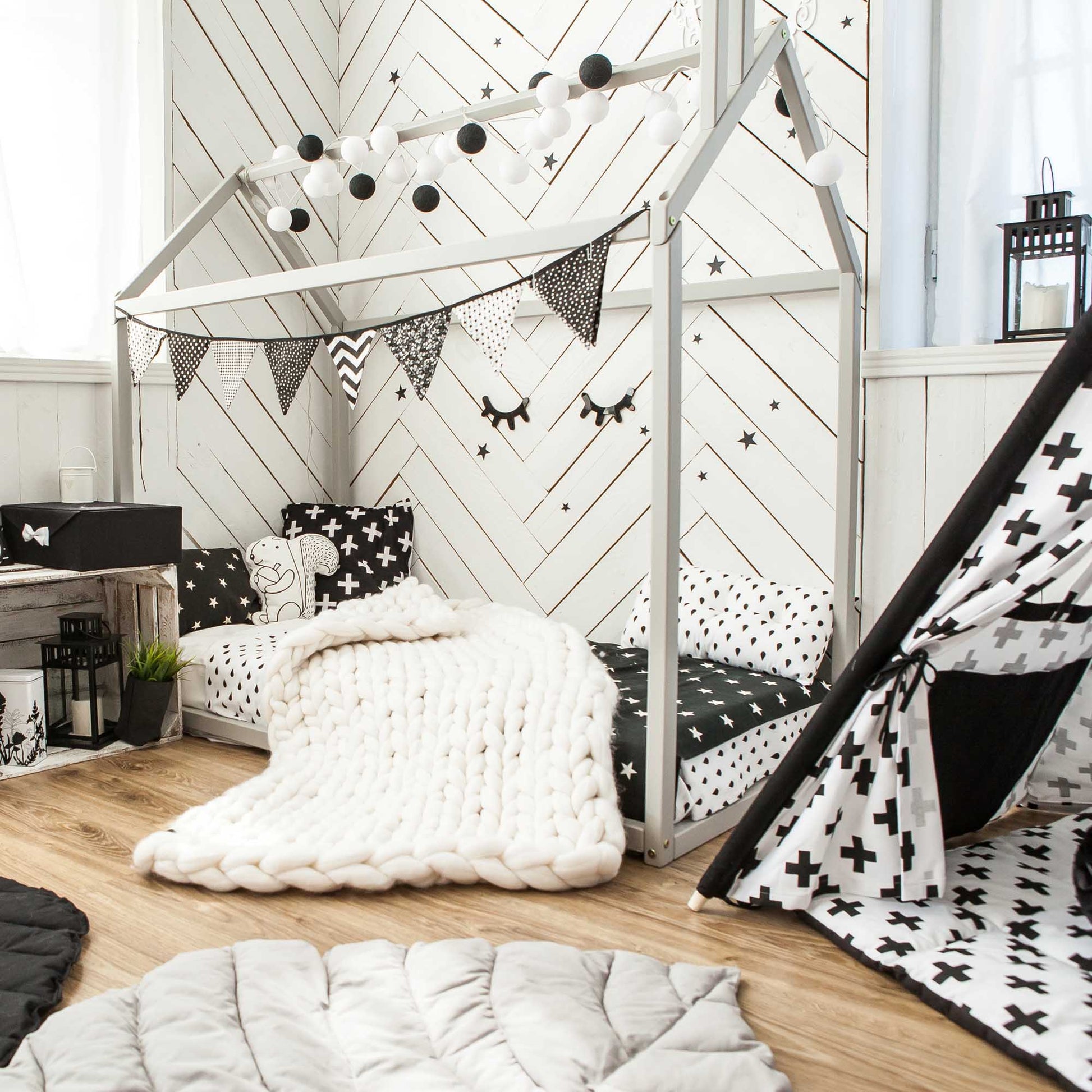 A cozy sleep haven with a Sweet Home From Wood Wooden zero-clearance house bed and a house-shaped canopy.