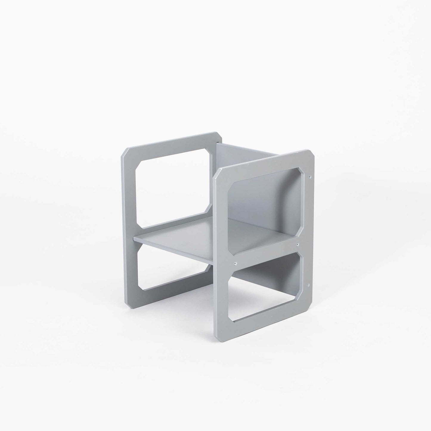 A small grey Montessori weaning table and Sweet Home From Wood chair set on a white background.