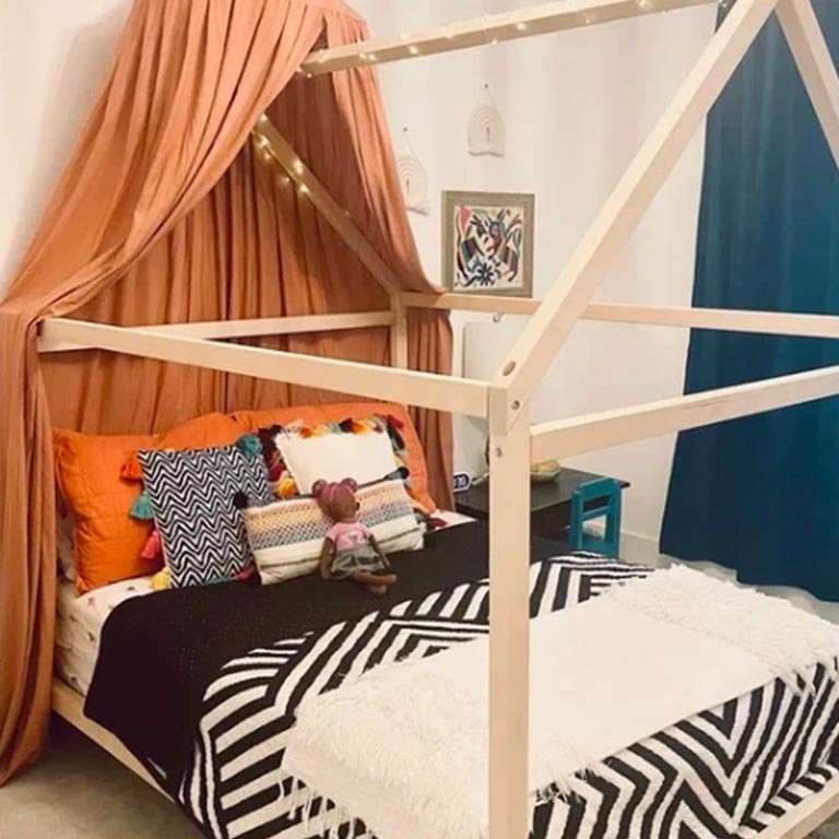 Customer photo of a house bed on legs.
