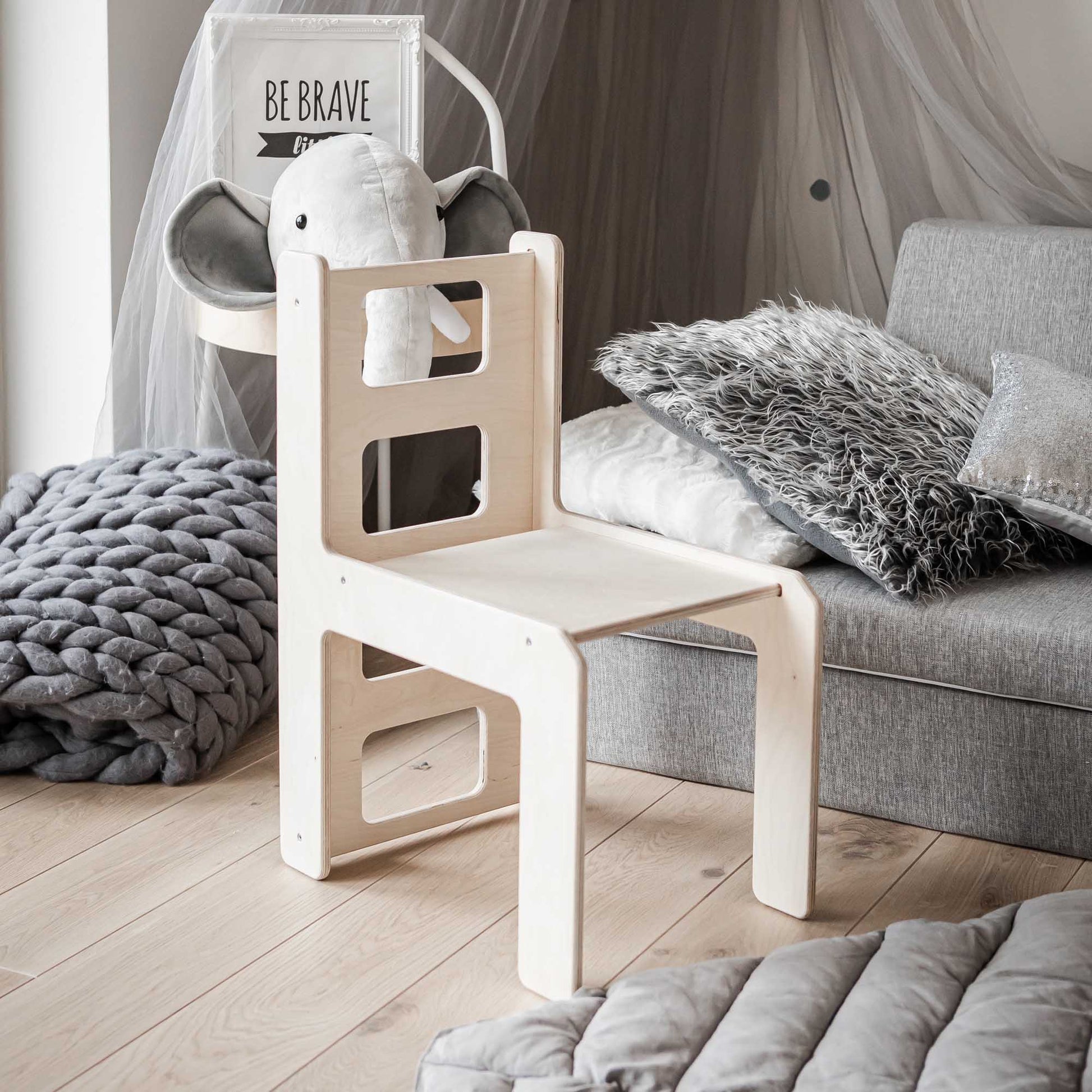 A Sweet Home From Wood 2-in-1 table and chair set or activity cube in a child's room.