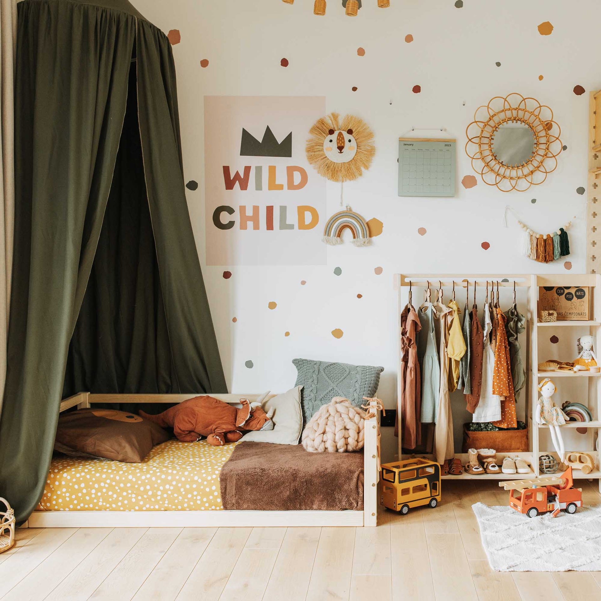 A Sweet Home From Wood children's floor level bed with 3-sided safety rail, complete with a canopy for added charm and comfort.