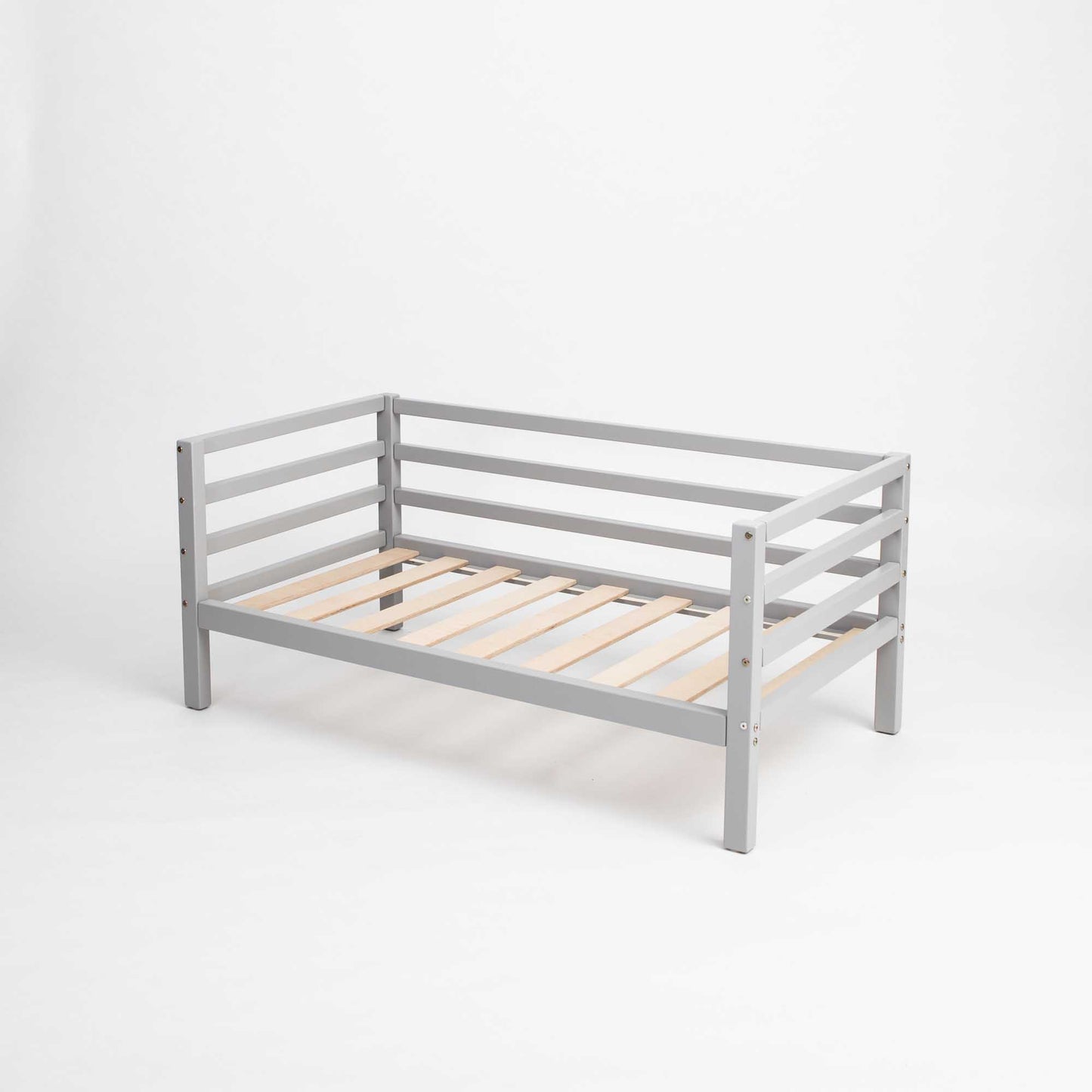 A Sweet Home From Wood Kids' bed on legs with a 3-sided horizontal rail against a white background.
