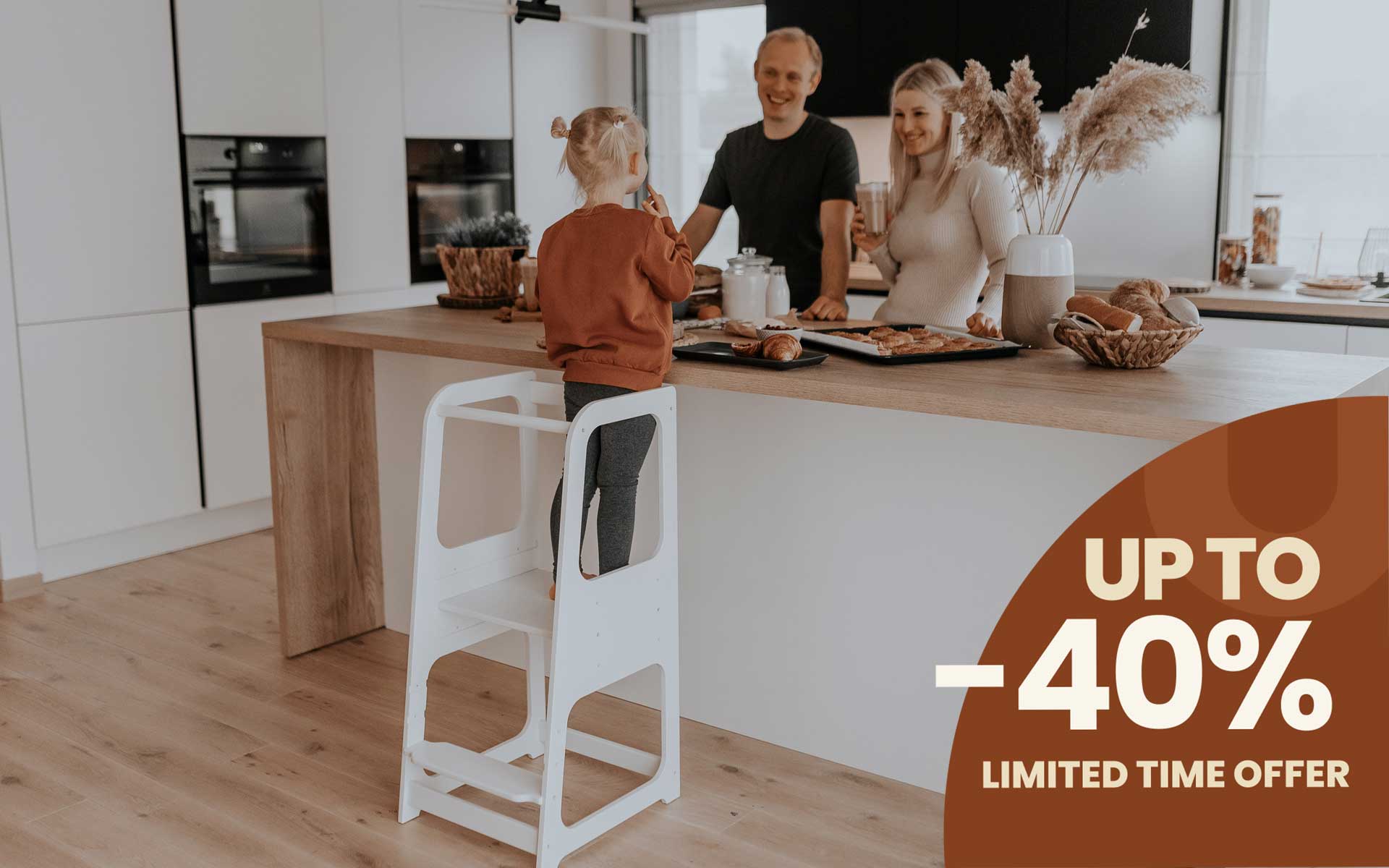 A girl standing on the Kitchen Tower with 3 height levels and cooking with her parents