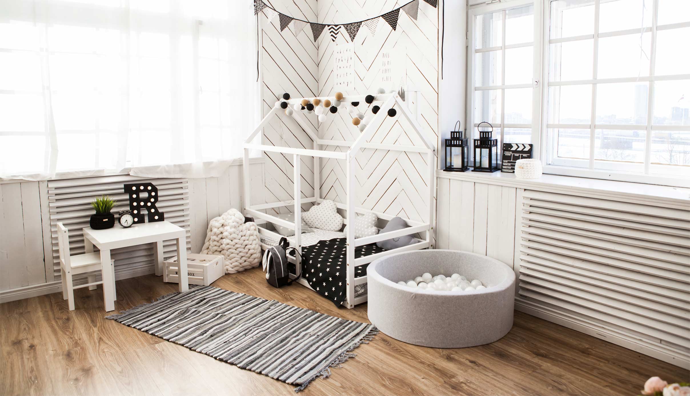 A child's room with black and white decor.