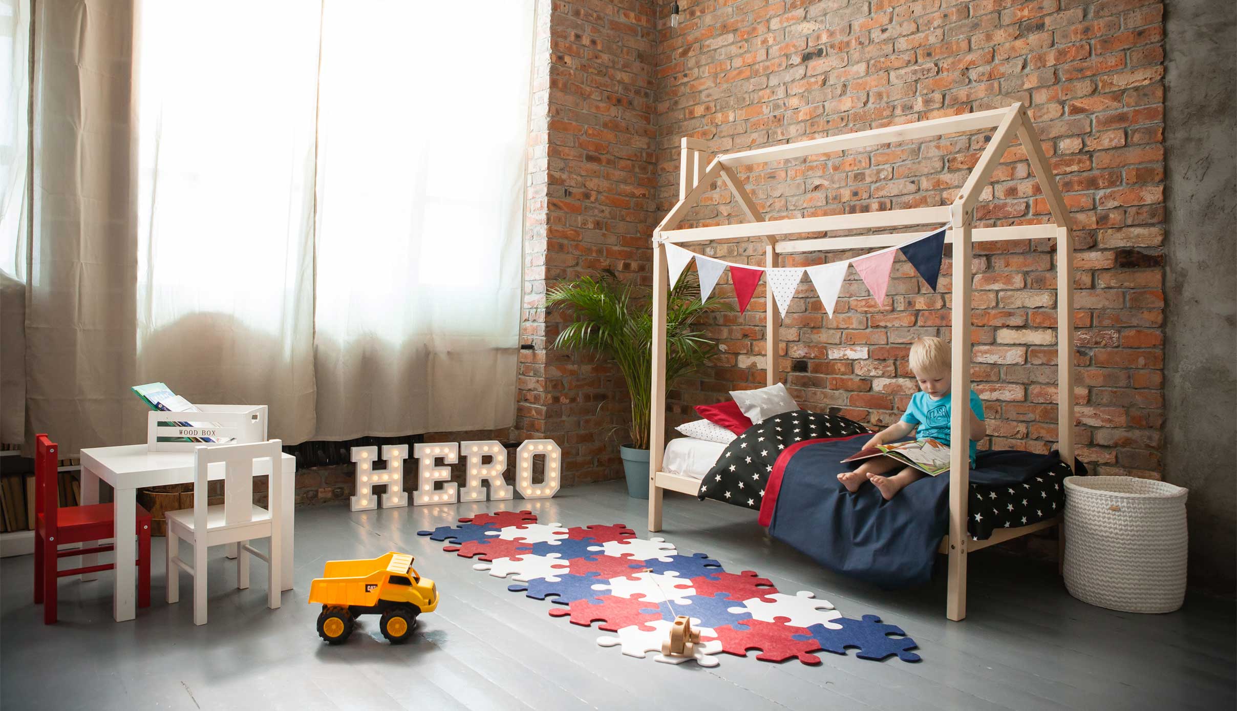 A child's room with a bed and toys.