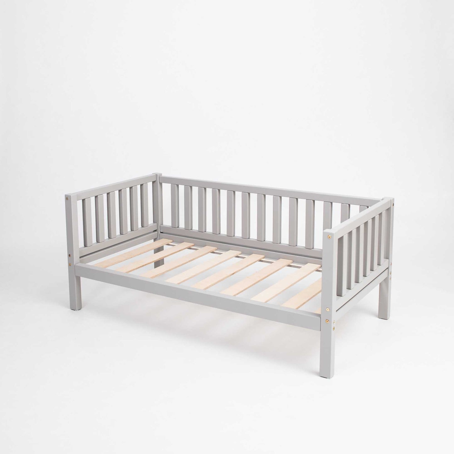 A grey Sweet Home From Wood Montessori-inspired daybed with wooden slats on a white background.