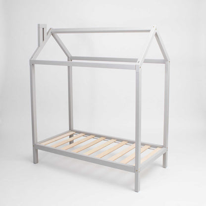 A grey wooden raised wooden house bed frame with a wooden slat.