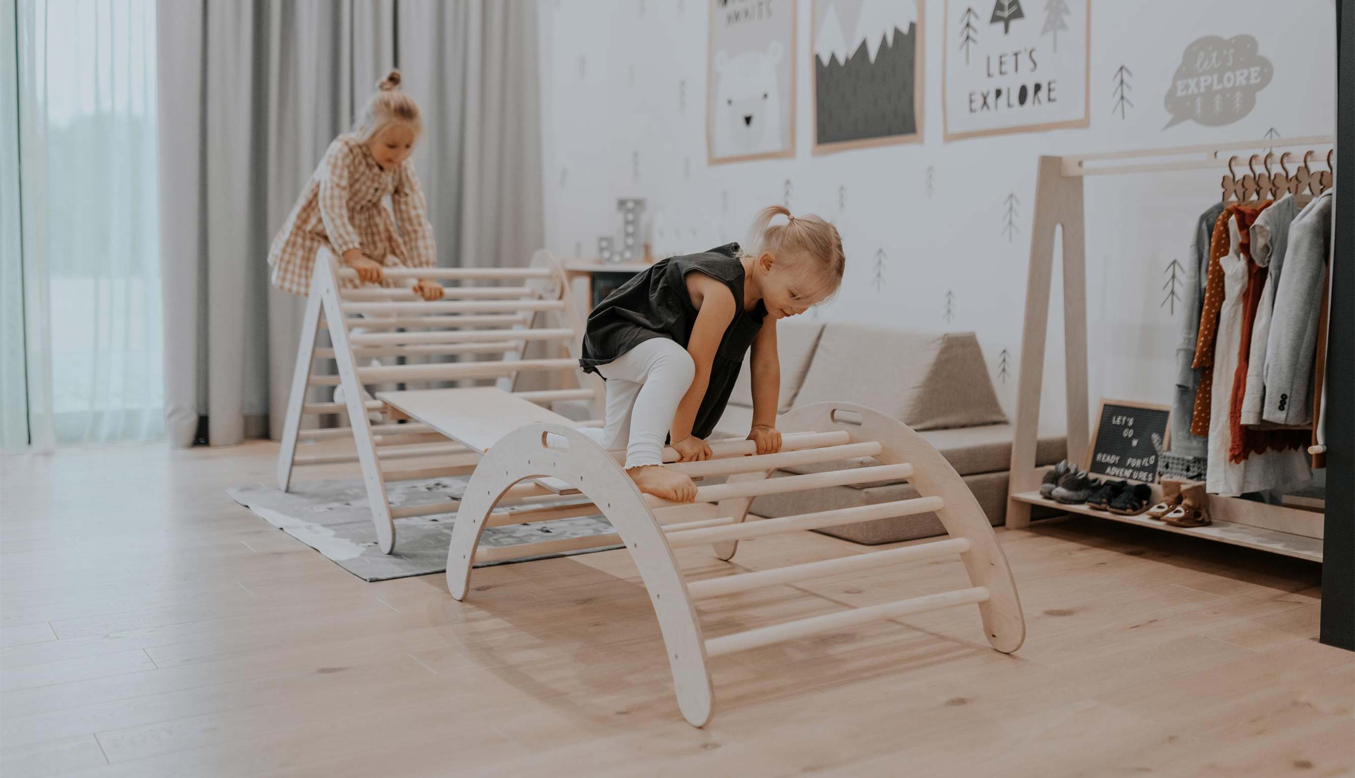 A child is playing with a wooden toy in a room.