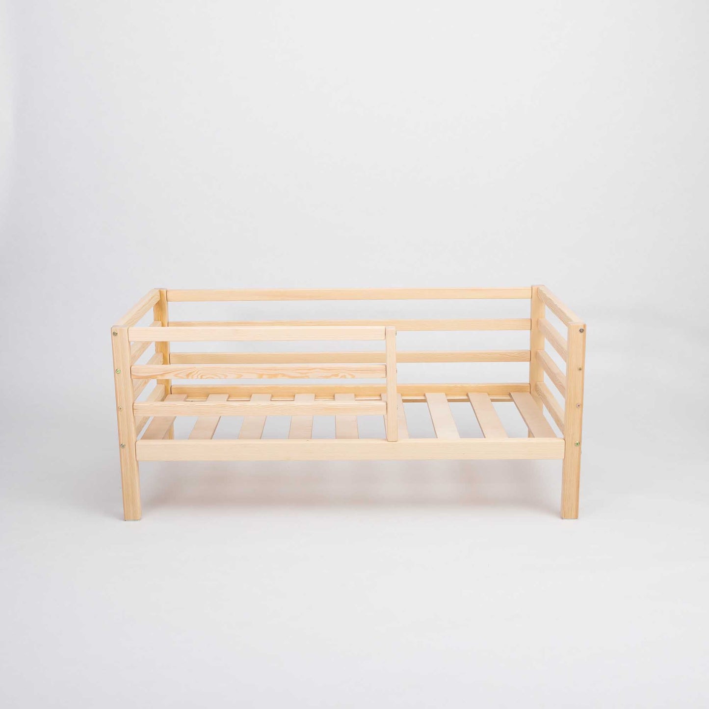 A Sweet Home From Wood Kids' bed on legs with a horizontal rail fence.