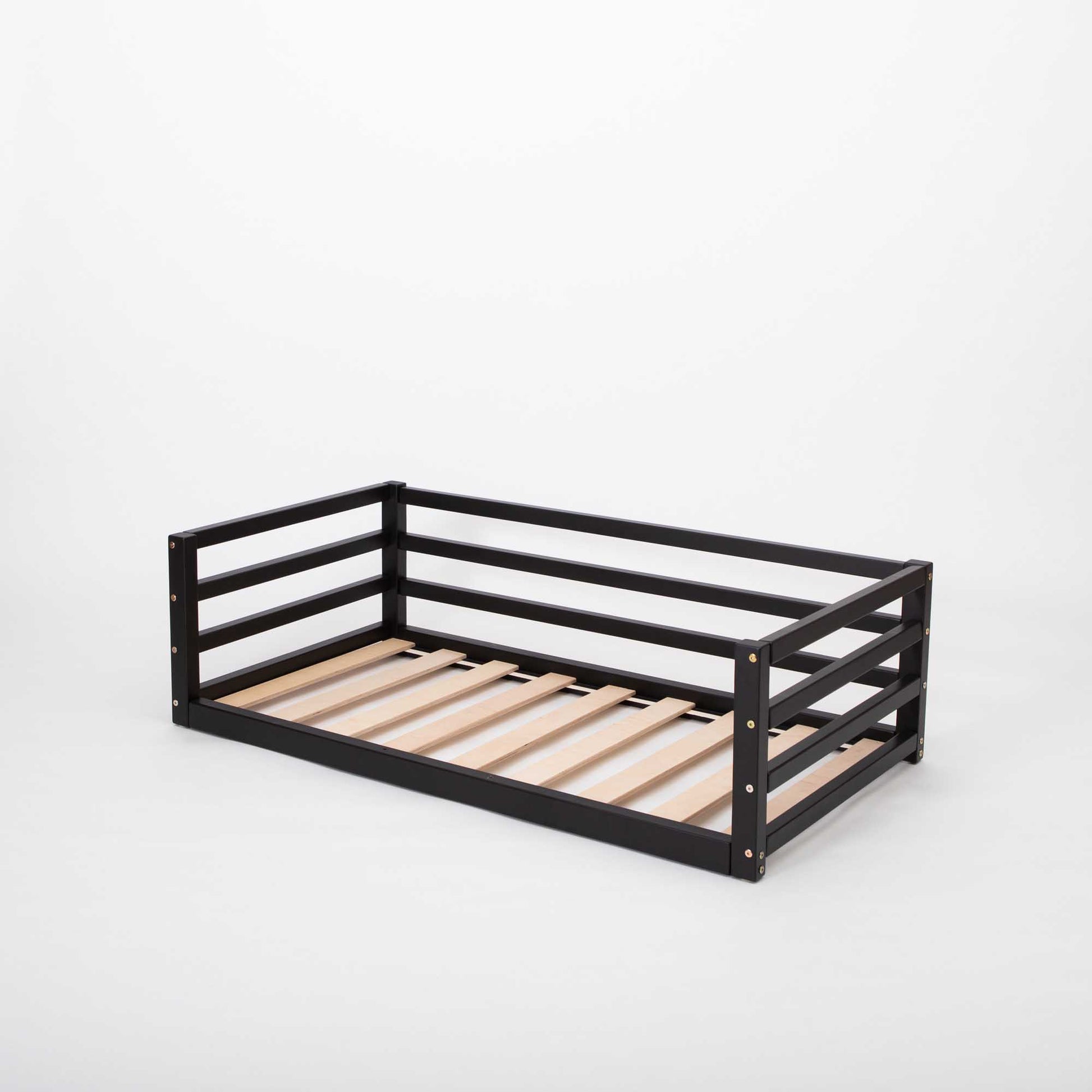 A Sweet Home From Wood transitional children's floor level bed with a 3-sided safety rail on a white background.