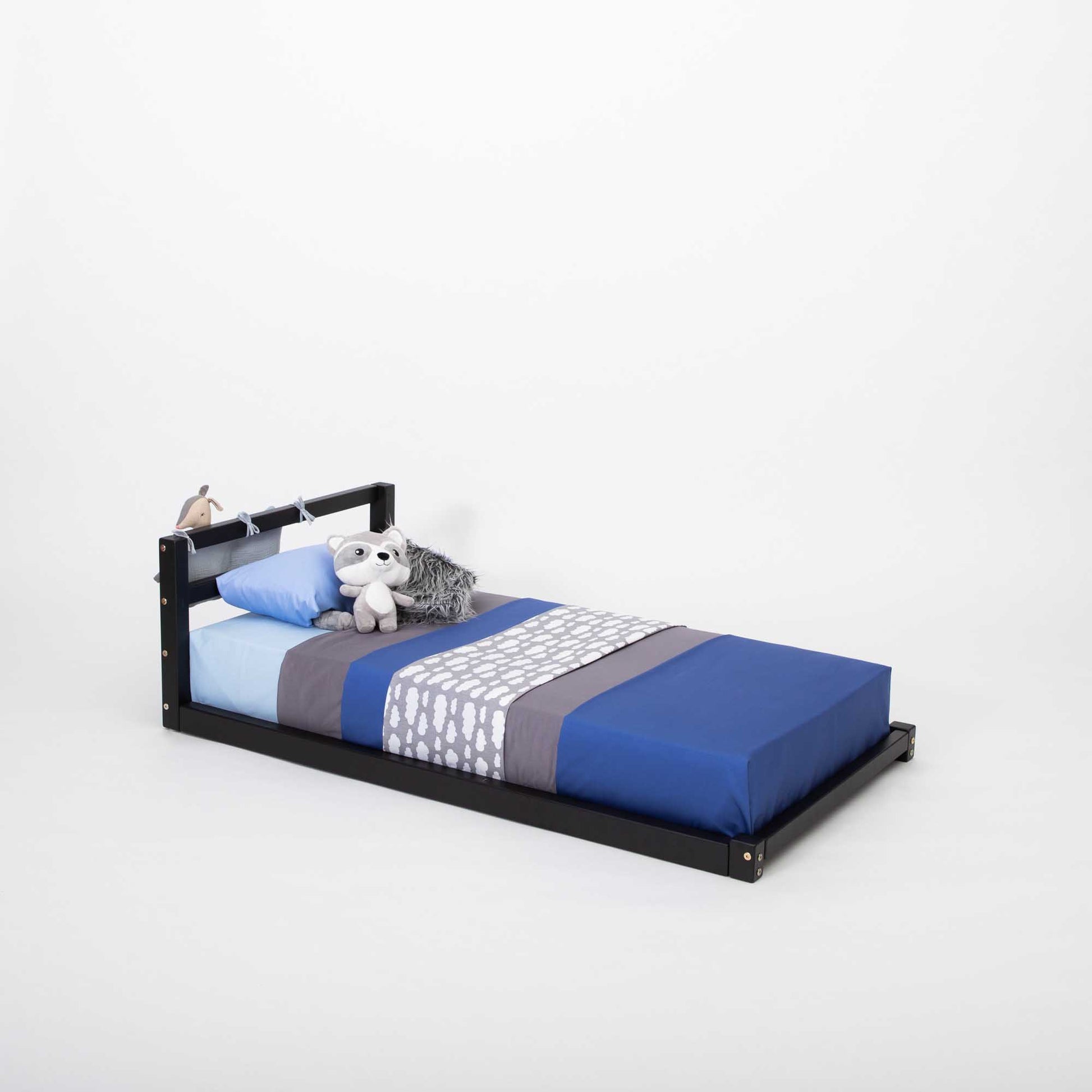 A Toddler floor bed with a horizontal rail headboard children's bed from Sweet Home From Wood.