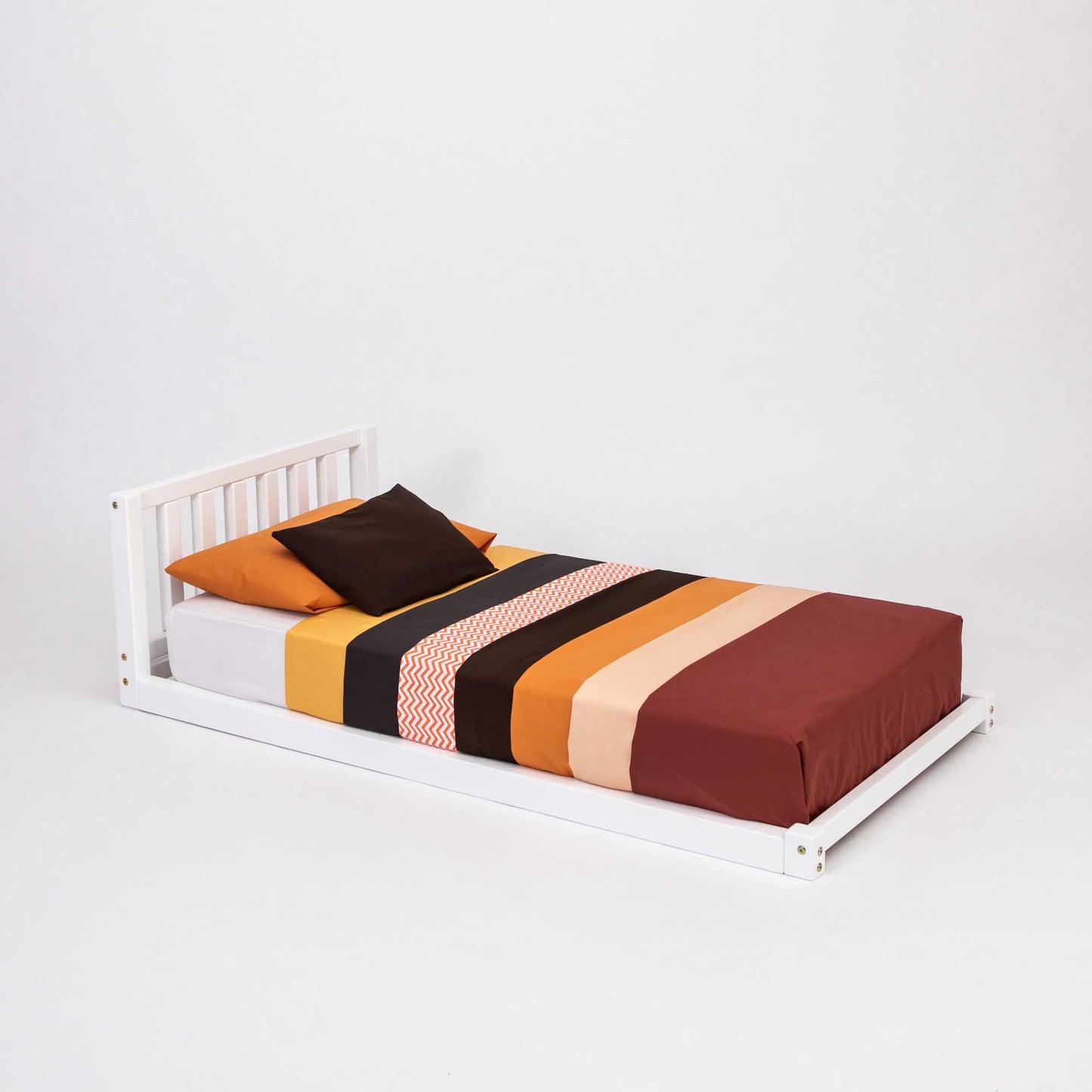 A Sweet Home From Wood 2-in-1 toddler bed on legs with a vertical rail headboard made of solid pine or birch wood, featuring striped sheets.