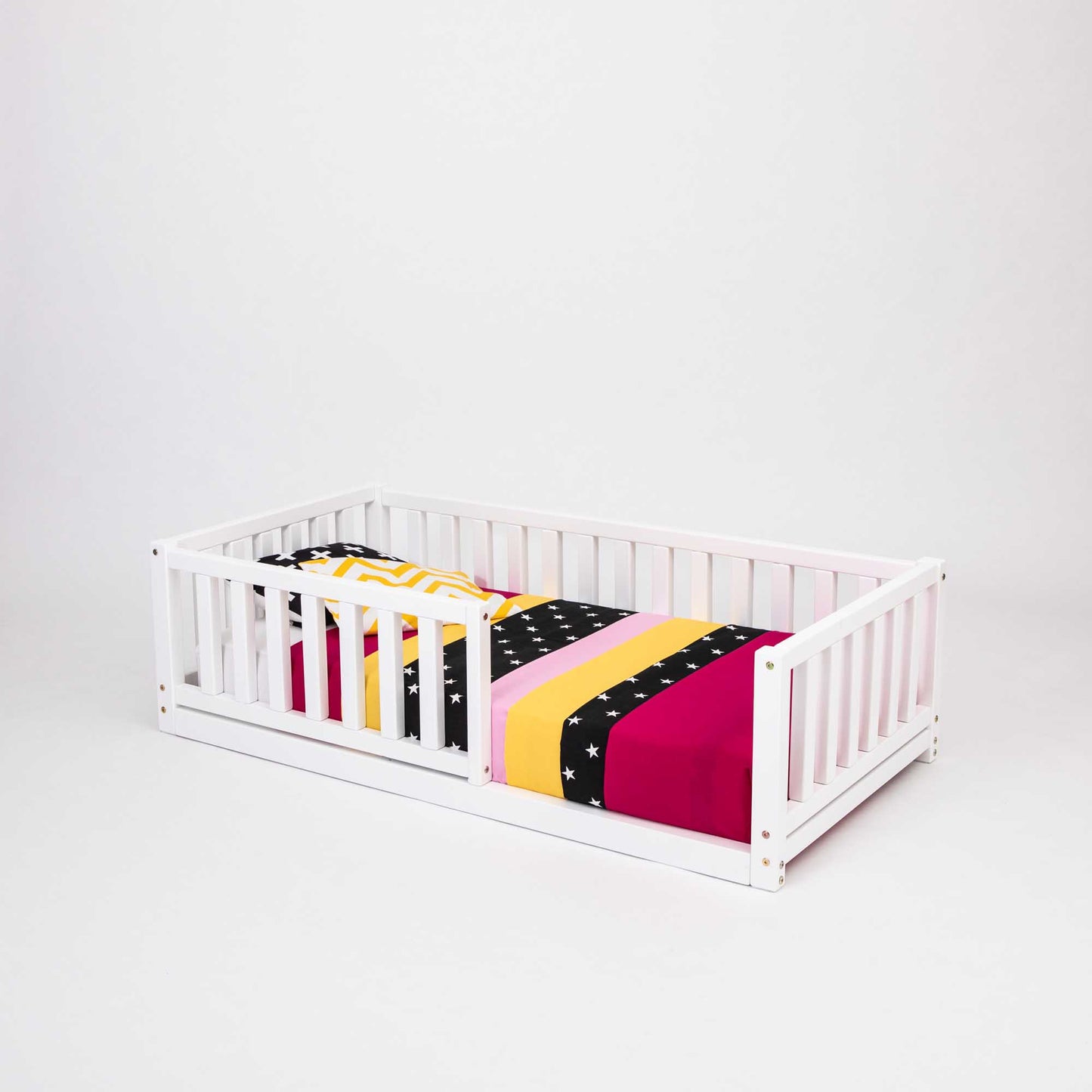 A long-lasting 2-in-1 toddler bed on legs with a vertical rail fence, made of solid pine from Sweet Home From Wood.