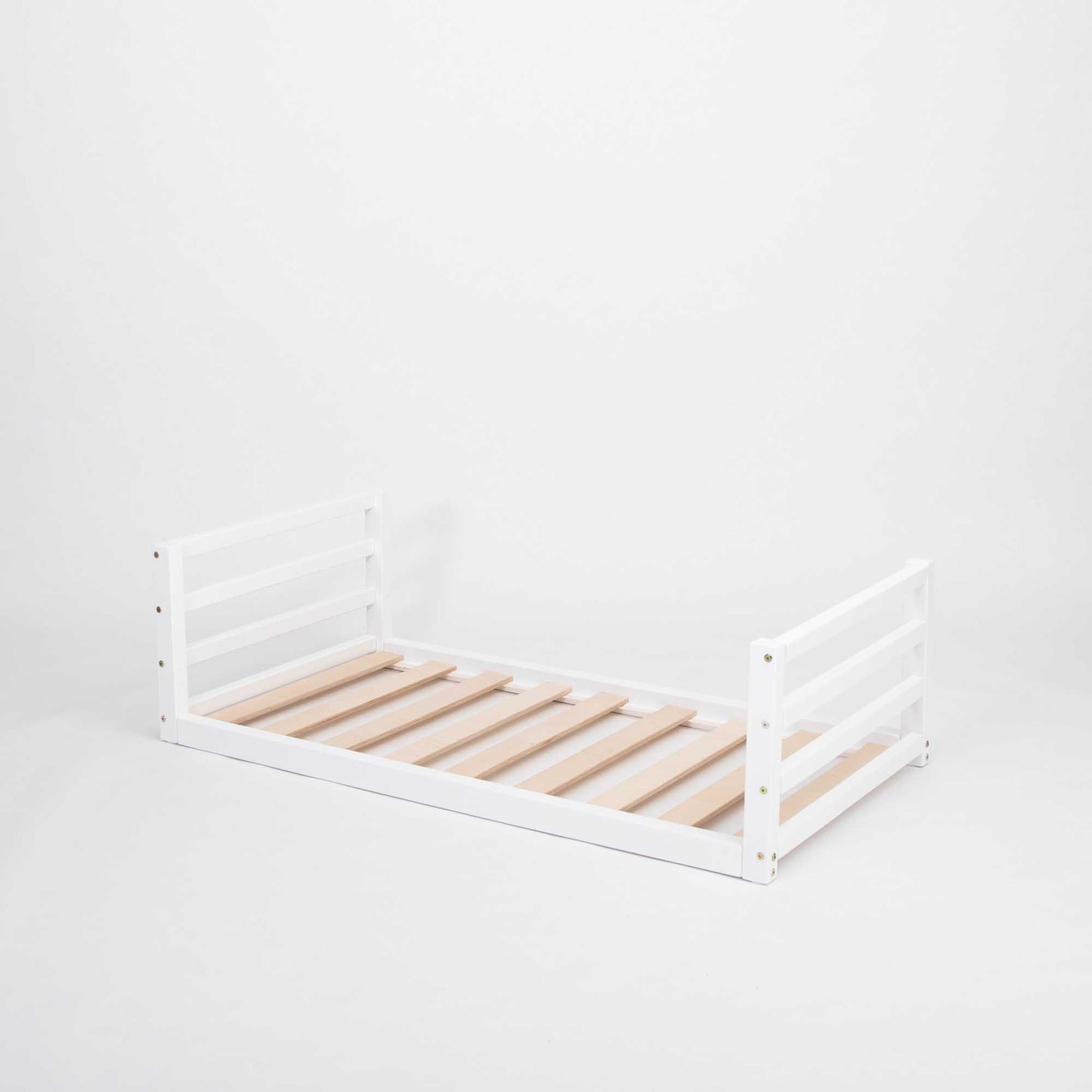 Toddler floor bed with a horizontal rail headboard and footboard