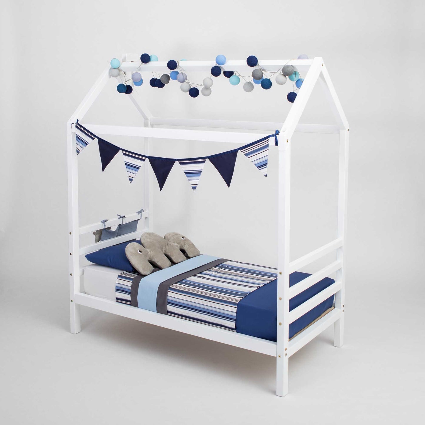 A Kids' house bed on legs with a headboard and footboard, with blue and white stripes and bunting.