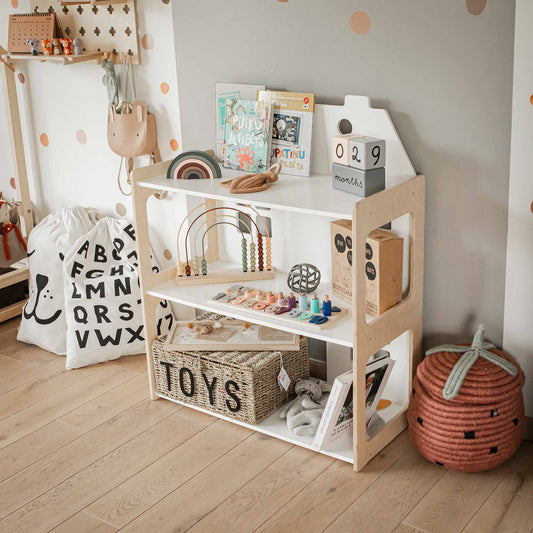 Dollhouse filled with toddler toys and books
