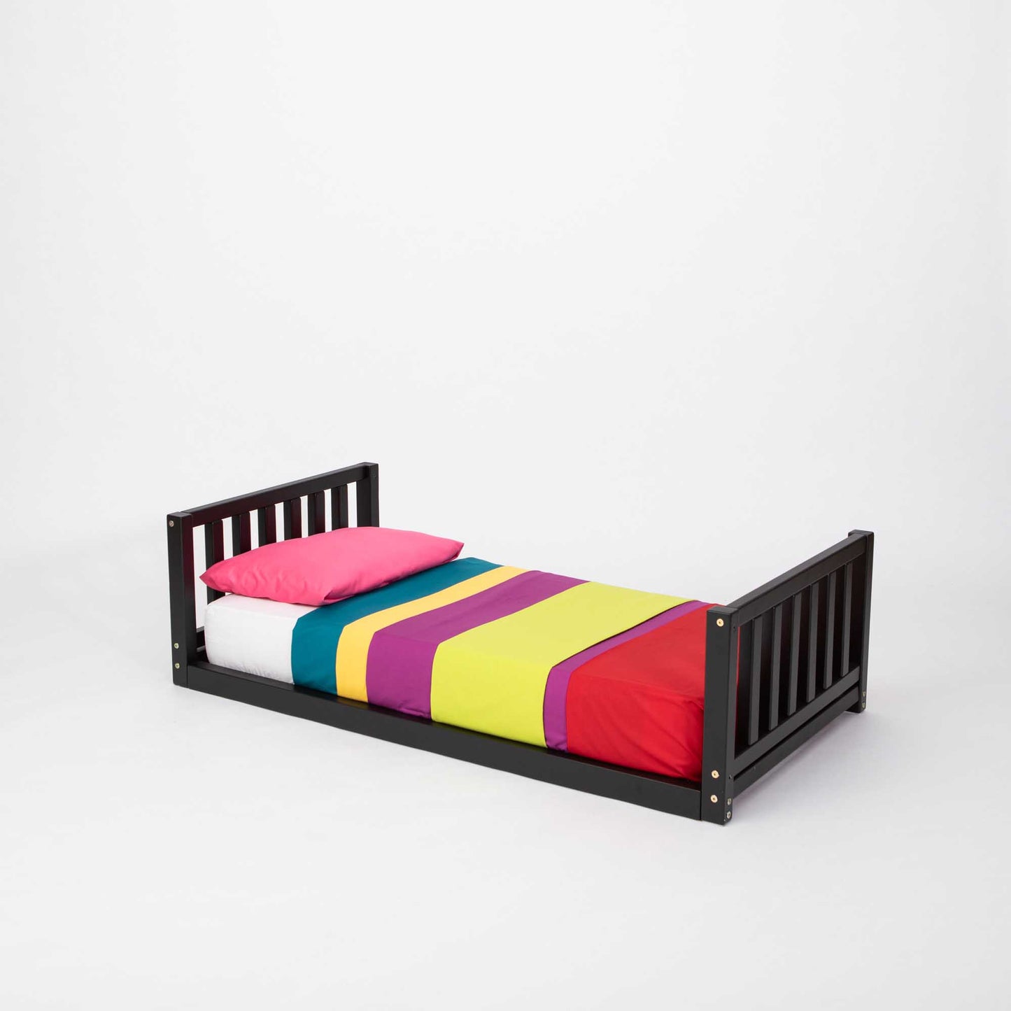 A 2-in-1 kid's bed on legs with a vertical rail headboard and footboard.