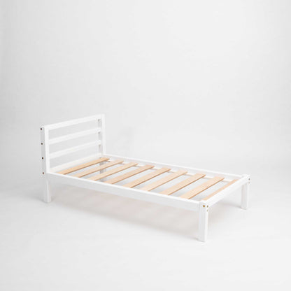 A white Kids' bed on legs with a horizontal rail headboard from Sweet Home From Wood, against a white background, perfect for Montessori-inspired toddler bed or co-sleeping setup. The sturdy frame ensures durability.
