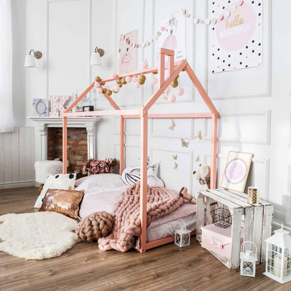 A cozy sleep haven for a girl's bedroom featuring a pink Sweet Home From Wood Wooden zero-clearance house bed.