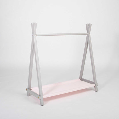 A Montessori-inspired Kids' clothing rack with storage.