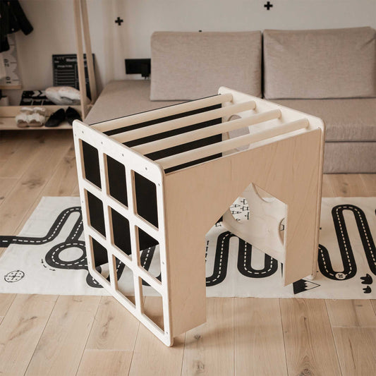 A Sweet Home From Wood activity cube with sensory panels in a living room.