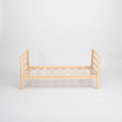 A Sweet Home From Wood Kids' bed on legs with a horizontal rail headboard and footboard with slats on a white background.