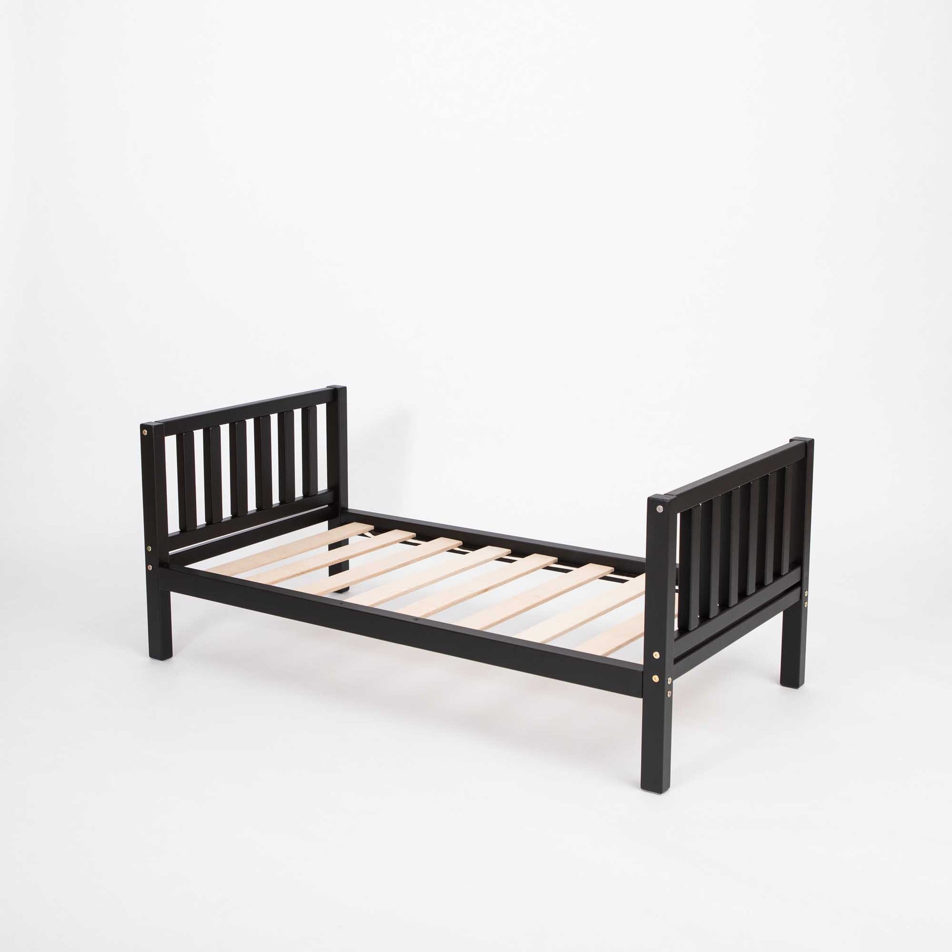 A Sweet Home From Wood Montessori-inspired black wooden toddler bed with wooden slats, promoting independence for children.