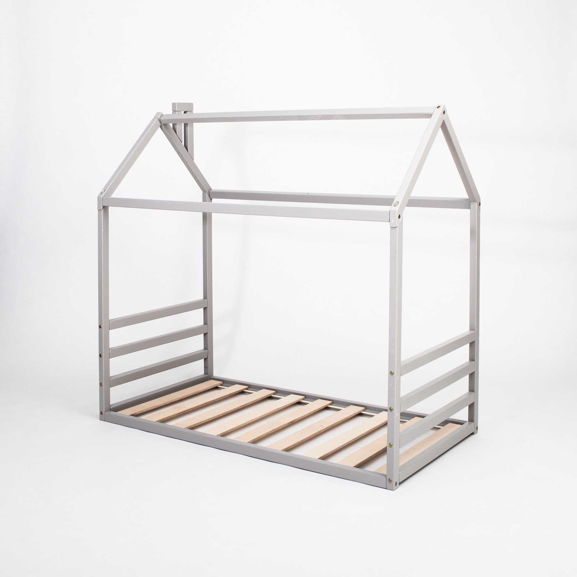 A grey metal floor house-frame bed with wooden slats, perfect as a montessori floor bed for toddlers.