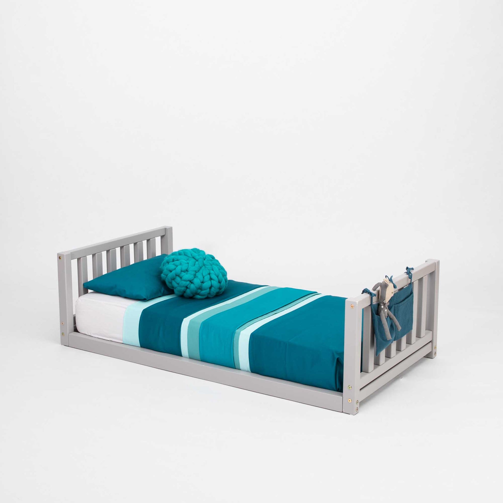 A 2-in-1 kid's bed on legs with a vertical rail headboard and footboard, made of solid pine or birch wood.