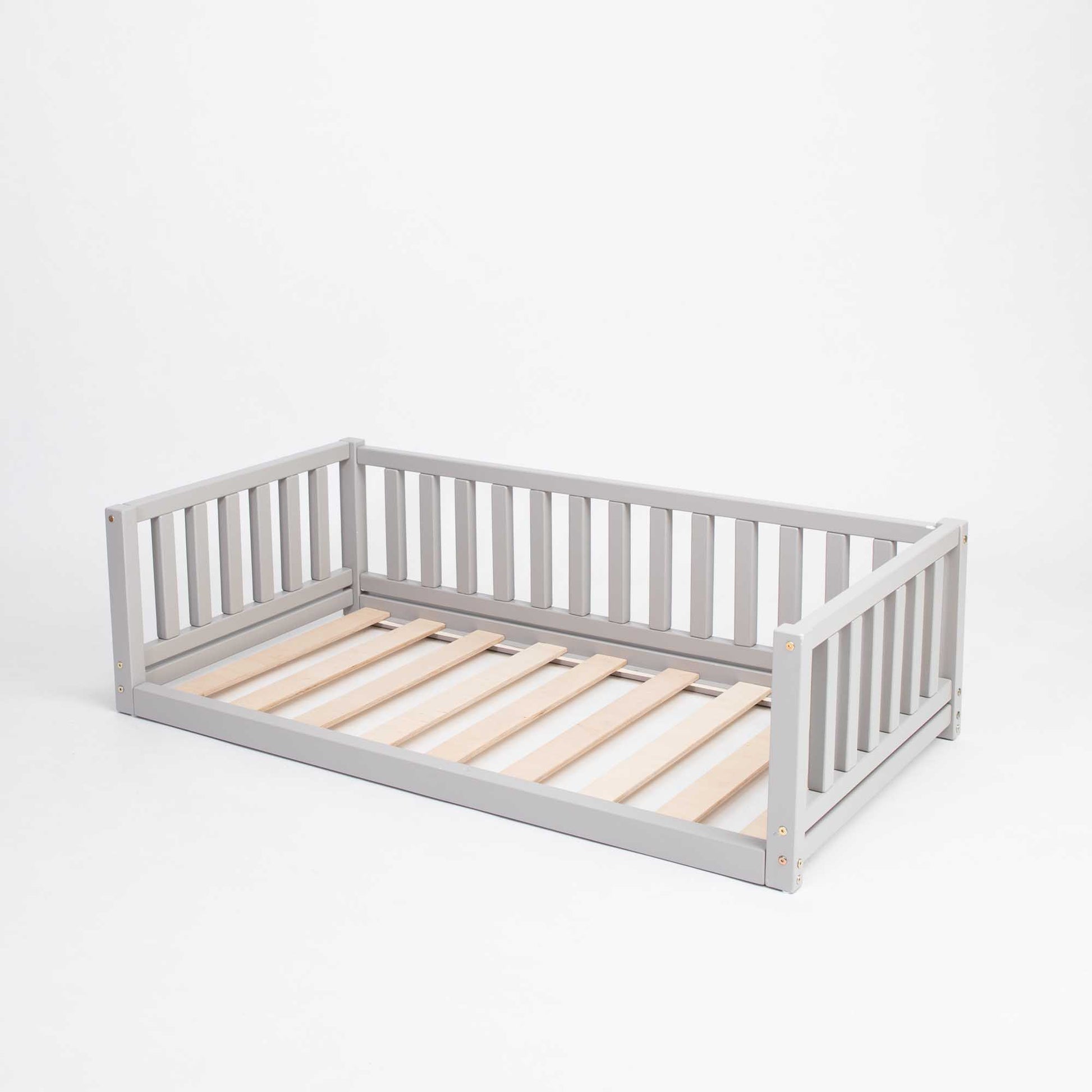 A Montessori bed with 3-sided rails, suitable for boys and girls from Sweet Home From Wood.