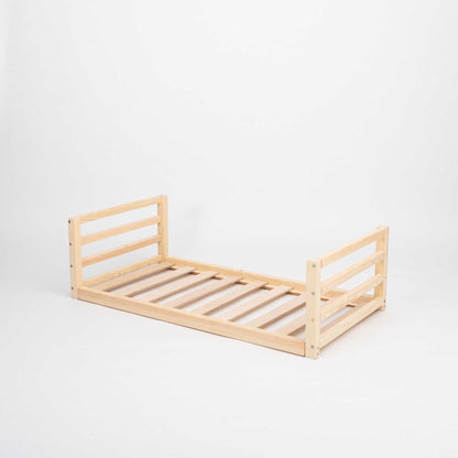 A Sweet Home From Wood toddler floor bed with a horizontal rail headboard and footboard, with slats on a white background.