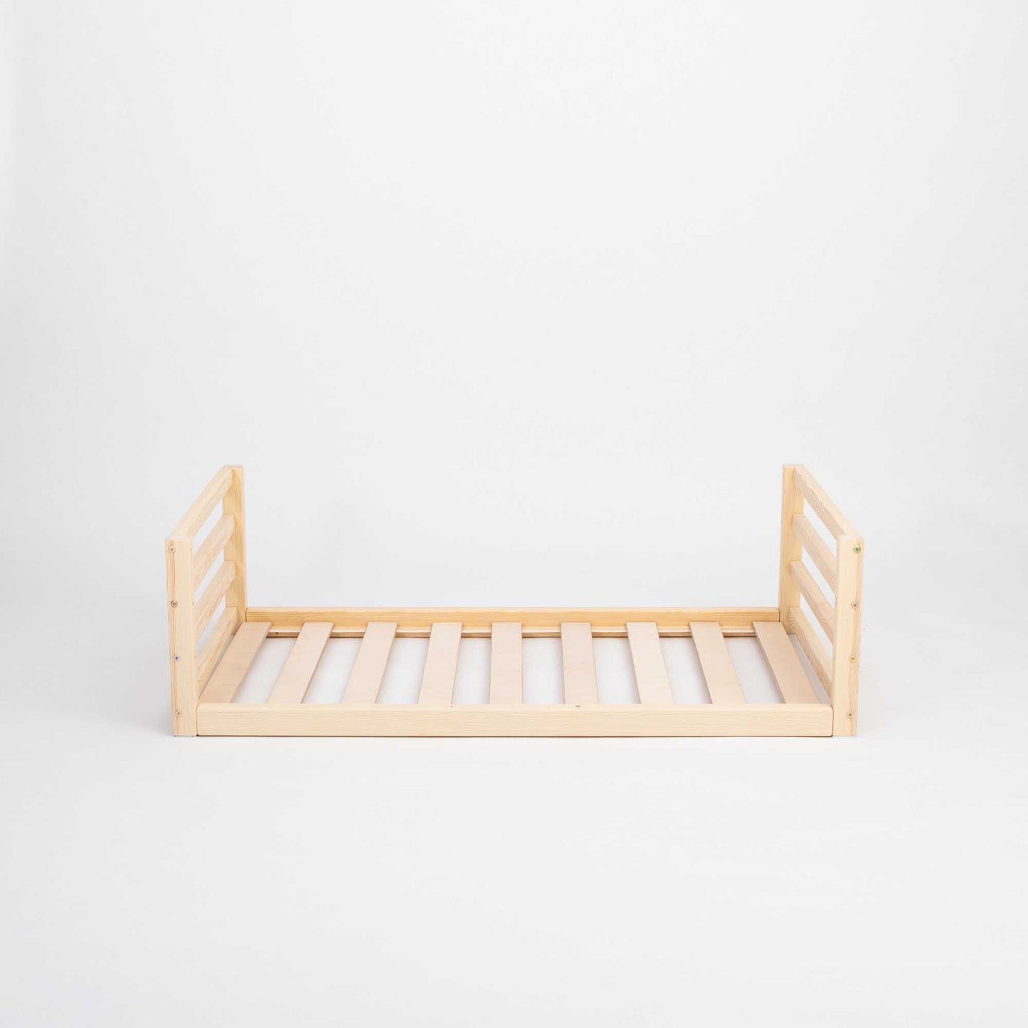 A Sweet Home From Wood toddler floor bed with a horizontal rail headboard and footboard, made of solid pine or birch wood with slats, placed on a white background.