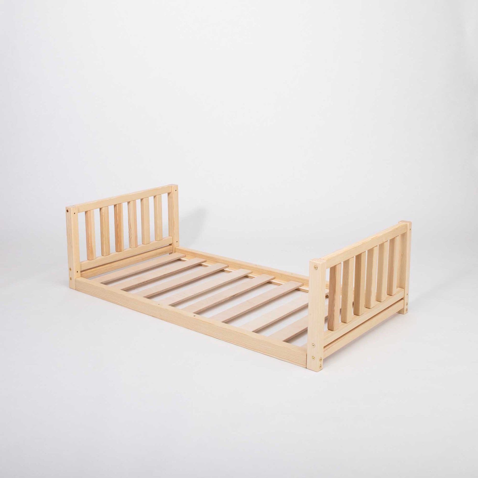 This 2-in-1 kid's bed on legs with a vertical rail headboard and footboard is made of solid pine or birch wood with slats, placed on a white background.