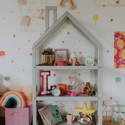 A Sweet Home From Wood House-shaped Montessori shelf with an open toy storage shelf.