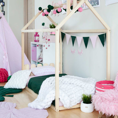 A girl's bedroom with a pink teepee bed, a low platform bed, and a Kids' house-frame bed with a picket fence headboard for toddlers.
