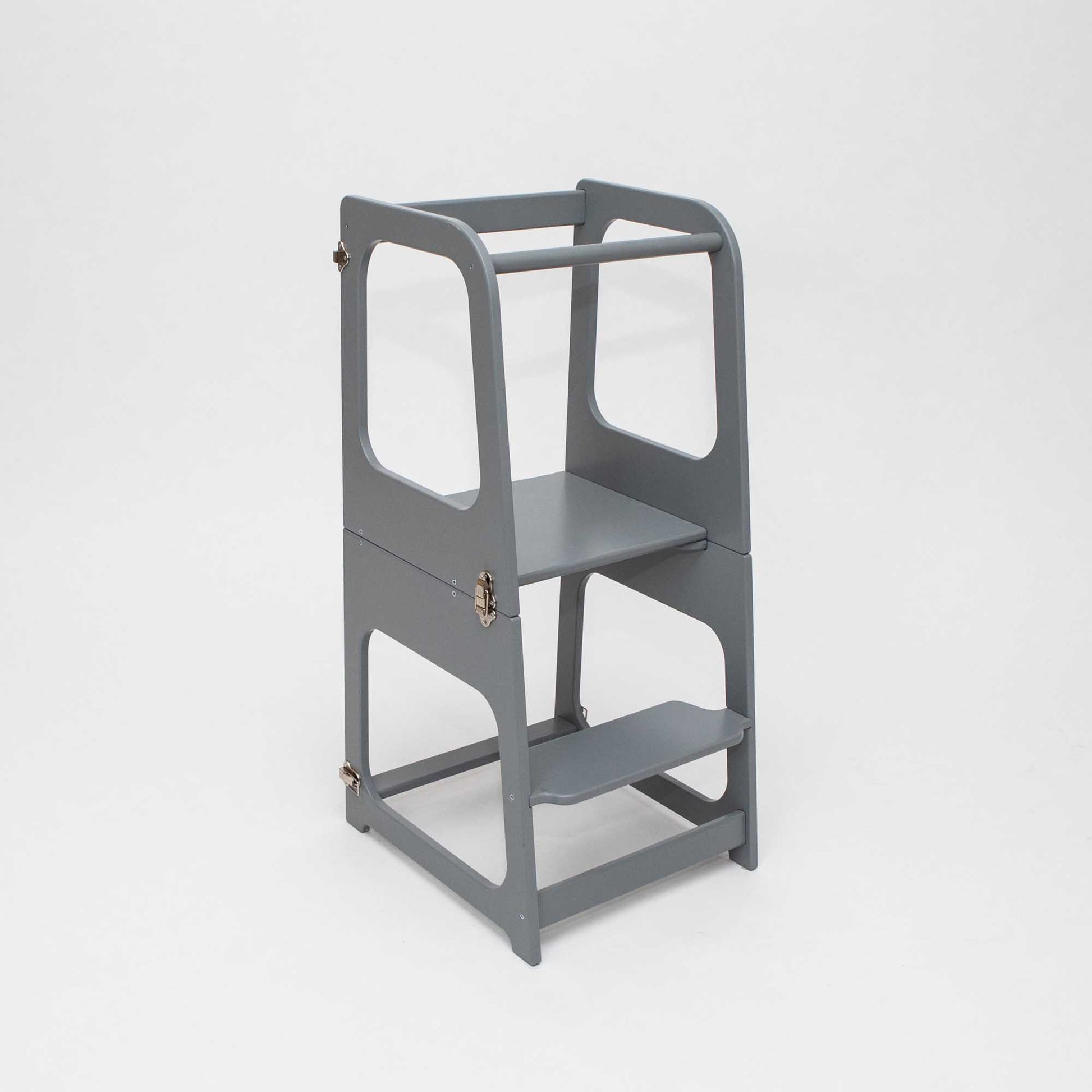 A 2-in-1 Convertible kitchen tower - table and chair for toddlers on a white background.