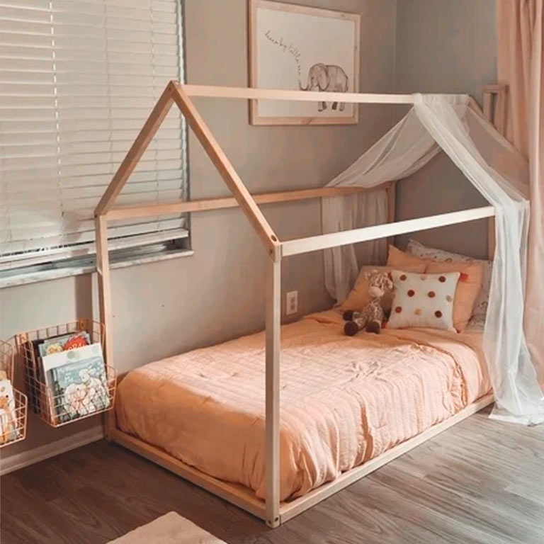 Customer photo of a floor house bed frame in a girl's room.