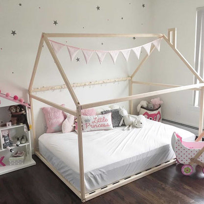 A cozy sleep haven for a girl's bedroom with a Sweet Home From Wood Wooden zero-clearance house bed.