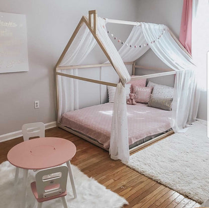 A cozy sleep haven with a pink Sweet Home From Wood Wooden zero-clearance house bed.