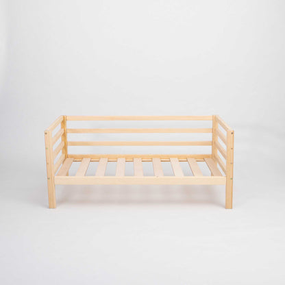 A Sweet Home From Wood kids' bed on legs with a 3-sided horizontal rail, designed to grow with your child, showcased against a white background.