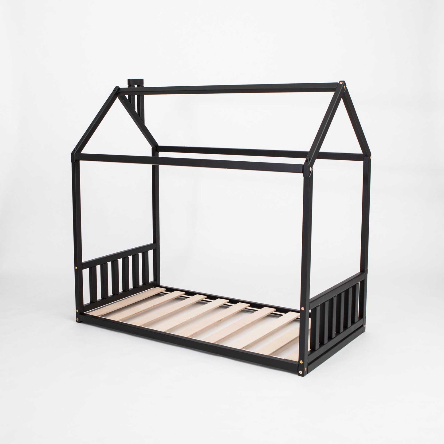 A cozy Sweet Home From Wood Toddler House Bed with a headboard and footboard made of black wooden slats, perfect for a preschooler's sleep haven.