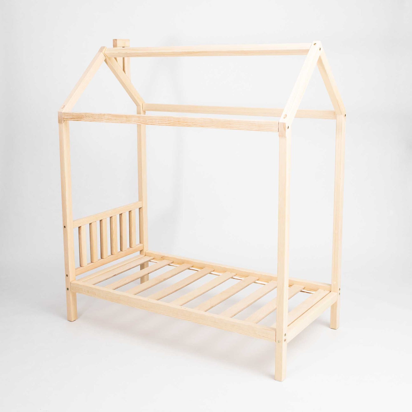 A toddlers' house bed on legs with a headboard and slats.