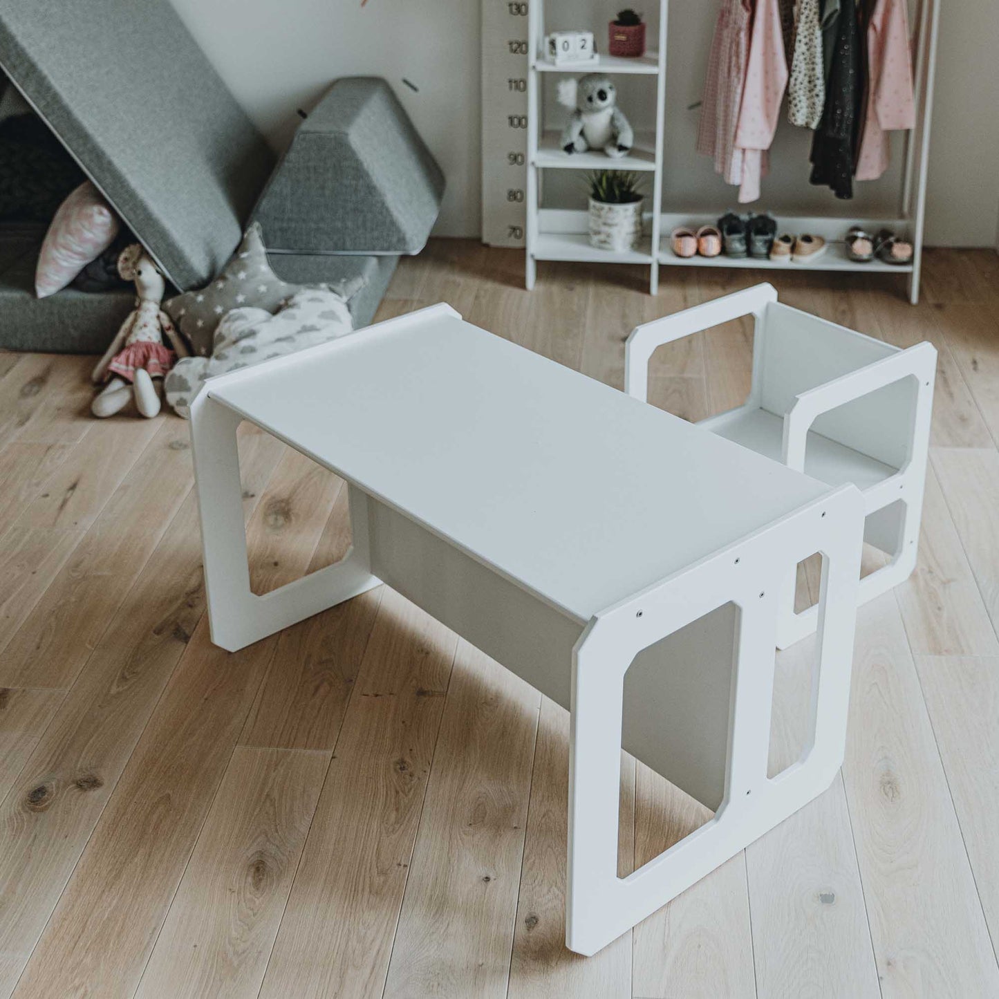 A Sweet Home From Wood Montessori weaning table and chair set in a child's room.