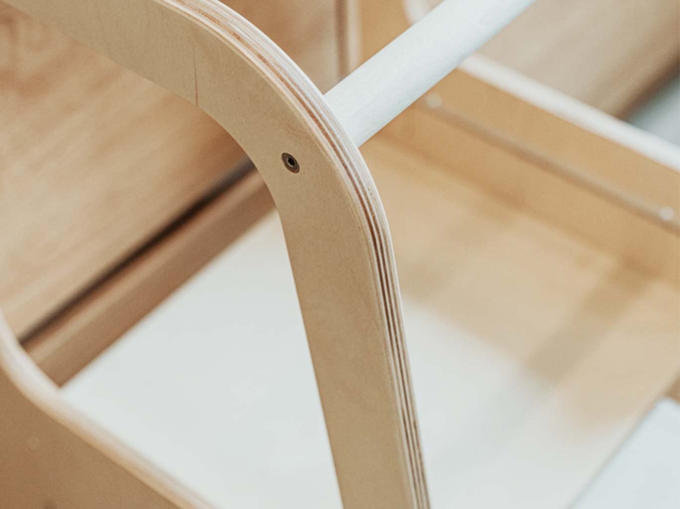 A close up of a wooden step stool.