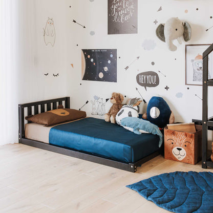 A child's room with a Sweet Home From Wood toddler bed with a headboard and a teddy bear suitable for boys or girls.